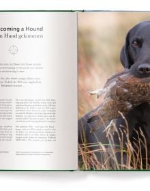 Book cover of Hunting: The Ultimate Book, with a dead pheasant, hare and pigeon strung upside down. Published by teNeues Books.