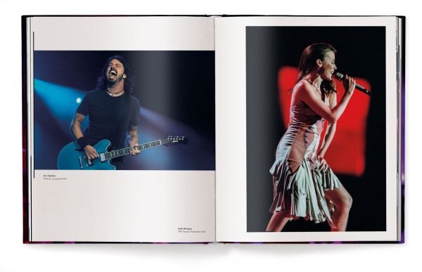 Book cover of Paul Bergen's Zero’s Heroes: Music Caught on Camera, featuring Shakira performing on stage with a guitar. Published by teNeues Books.
