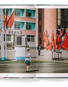 Book cover of Xiomara Bender's Waiting for the Rainbow: Ten Years in North Korea, with a group of dancers lining up in red costumes. Published by teNeues Books.