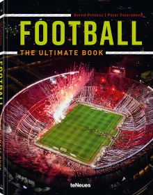 Aerial view of football stadium with red flares and ribbons, on cover of Football: The Ultimate Book, by teNeues Books.