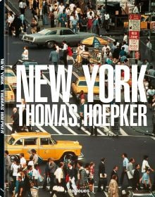Aerial view of busy New York street with people crossing the road, and yellow taxis, on cover of Thomas Hoepker's photobook. Published by teNeues Books.