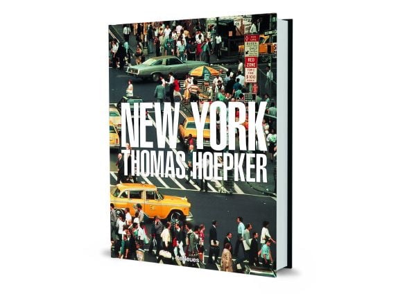 Aerial view of busy New York street with people crossing the road, and yellow taxis, on cover of Thomas Hoepker's photobook. Published by teNeues Books.