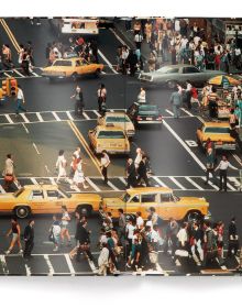 Aerial view of busy New York street with people crossing the road, and yellow taxis, on cover of Thomas Hoepker's photobook. Published by teNeues Books.