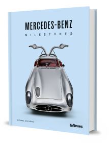 Book cover of Michael Köckritz's car guide, Mercedes-Benz Milestones, featuring a silver Mercedes-Benz 300 SLR gullwing Uhlenhaut, with doors open. Published by White Star.