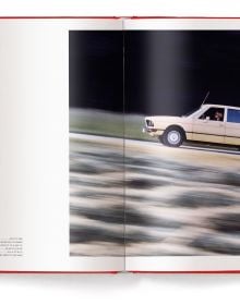 Book cover of Michael Köckritz's guide BMW Milestones, featuring the front of a red BMW M1. Published by White Star.