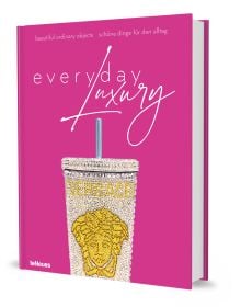 Book cover of Agata Toromanoff's Everyday Luxury: Beautiful Ordinary Objects, with a diamond encrusted steel drinks cup with straw, by Versace. Published by teNeues Books.