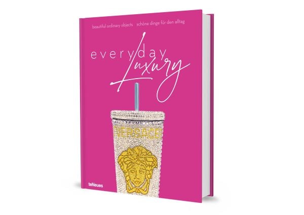 Book cover of Agata Toromanoff's Everyday Luxury: Beautiful Ordinary Objects, with a diamond encrusted steel drinks cup with straw, by Versace. Published by teNeues Books.