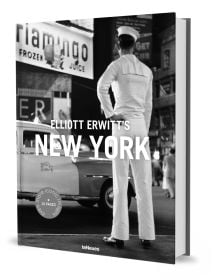 Man wearing white sailor's clothes and hat, with his back to viewer, staring across busy city street, on cover of 'Elliott Erwitt’s New York', by teNeues Books.