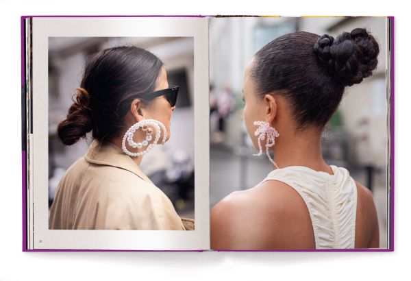 Book cover of Suzanne Middlemass's It’s All About Accessories, with a model wearing a yellow jacket and two large brooches to right lapel. Published by teNeues Books.