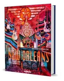 Book cover of Werner Pawlok's New Orleans, with colourful interior with guitars on wall and religious figure to centre. Published by teNeues Books.