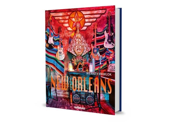 Book cover of Werner Pawlok's New Orleans, with colourful interior with guitars on wall and religious figure to centre. Published by teNeues Books.