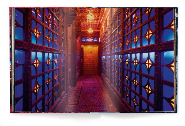 Book cover of Werner Pawlok's New Orleans, with colourful interior with guitars on wall and religious figure to centre. Published by teNeues Books.