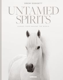 Book cover of Drew Doggett's Untamed Spirits: Horses from Around the World, with a white horse. Published by teNeues Books.