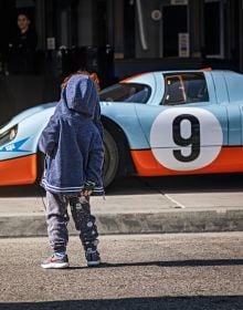 Book cover of Michael Köckritz's The Porsche Book, with a light blue Porsche 911 S-T 2024. Published by teNeues Books.