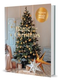 Book cover of Claire Bingham's Home for Christmas, with an interior living room with wood floors and a green Christmas tree decorated with gold baubles. Published by teNeues Books.