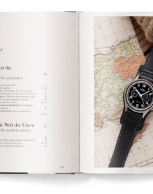 Book cover of The Watch Book: Hanhart: und die deutsche Uhrenindustrie / and the German Watch Industry, featuring a watch with black face and strap. Published by teNeues Books.