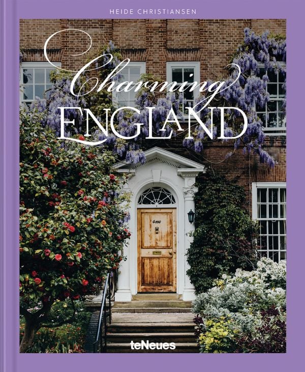 Book cover of Charming England, featuring purple wisteria hanging above a wood door. Published by teNeues Books.