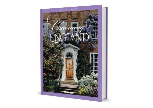 Book cover of Charming England, featuring purple wisteria hanging above a wood door. Published by teNeues Books.