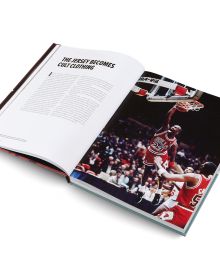 Book cover of Basketball: The Ultimate Book, with an aerial view of two players on court with orange ball. Published by teNeues Books.
