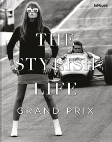 Book cover of The Stylish Life: Grand Prix, featuring a model in 60s clothes standing on race track with car and driver behind. Published by teNeues Books.