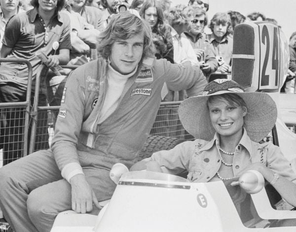 Book cover of The Stylish Life: Grand Prix, featuring a model in 60s clothes standing on race track with car and driver behind. Published by teNeues Books.