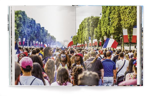 Book cover of Paris Blues, with a couple embracing, and a push bike on a stand behind them. Published by teNeues Books.