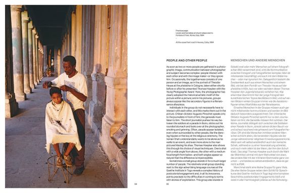 Book cover of Thomas Hoepker: Stories of Humanity; featuring a child on a cobbled street giving a bird some food. Published by teNeues Books.