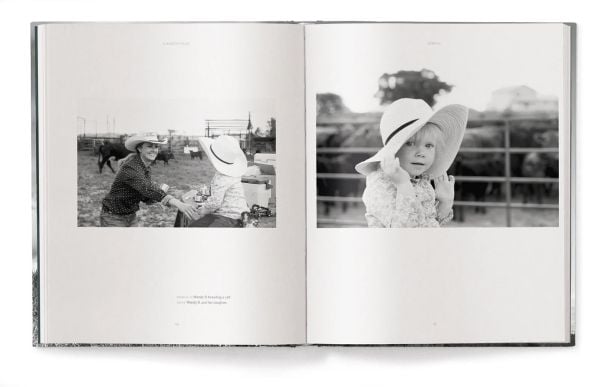 Book cover of A Ranch Year: Cowboys of the West; featuring two figures on horseback riding over a grassy mound, away from the viewer. Published by teNeues Books.