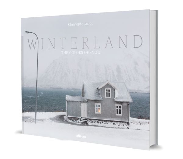 Book cover of Winterland: The Colors of Snow; featuring a snowy landscape with a house and mountain behind. Published by teNeues Books.