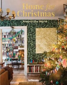 Book cover of Home for Christmas - Around the World; featuring a festive interior with a Christmas tree decorated in country flags. Published by teNeues Books.