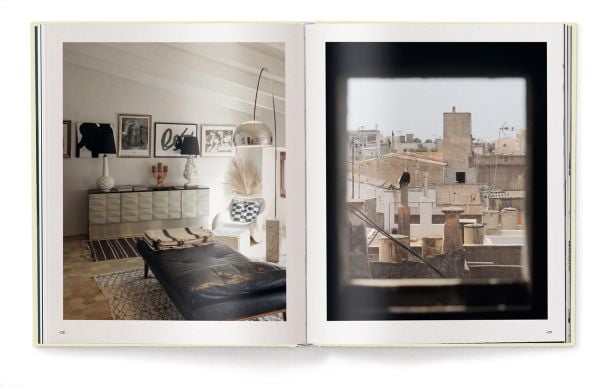 Book cover of Creating a New Home in Mallorca; featuring a hallway with a grand arch, and black and white floor tiles. Published by teNeues Books.