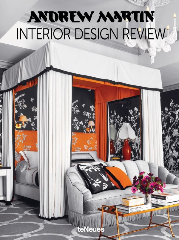 Book cover of Andrew Martin Interior Design Review Vol. 29; featuring a four poster bed with long white drapes and floral wallpaper. Published by teNeues Books.