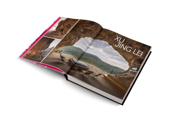 Book cover of Andrew Martin Interior Design Review Vol. 29; featuring a four poster bed with long white drapes and floral wallpaper. Published by teNeues Books.