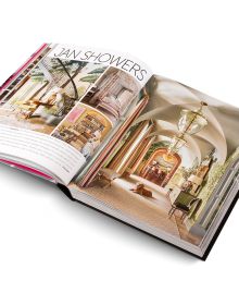 Book cover of Andrew Martin Interior Design Review Vol. 29; featuring a four poster bed with long white drapes and floral wallpaper. Published by teNeues Books.