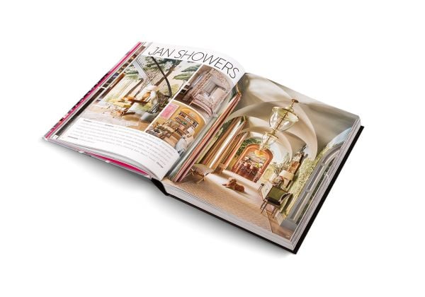 Book cover of Andrew Martin Interior Design Review Vol. 29; featuring a four poster bed with long white drapes and floral wallpaper. Published by teNeues Books.