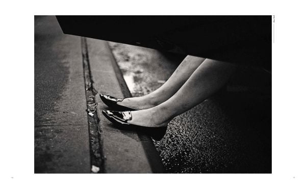 Book cover of Phil Penman: Street Scenes; featuring a figure walking across a misty street with traffic lights on red. Published by teNeues Books.