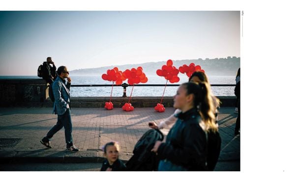 Book cover of Phil Penman: Street Scenes; featuring a figure walking across a misty street with traffic lights on red. Published by teNeues Books.