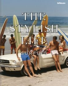 Book cover of The Stylish Life: Surfing; featuring a group of surfers sitting on a white car on the beach. Published by teNeues Books.