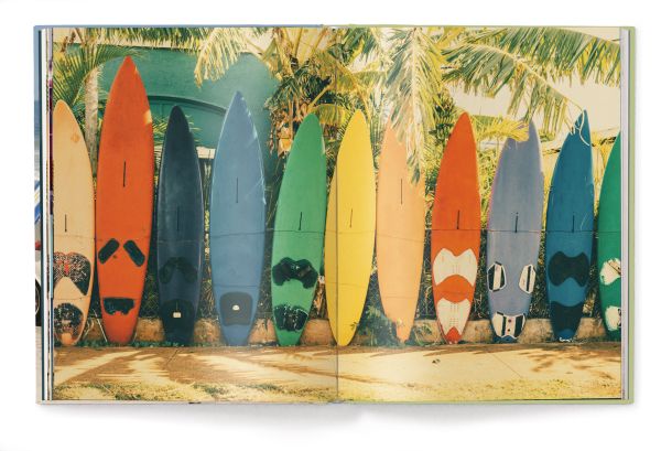 Book cover of The Stylish Life: Surfing; featuring a group of surfers sitting on a white car on the beach. Published by teNeues Books.