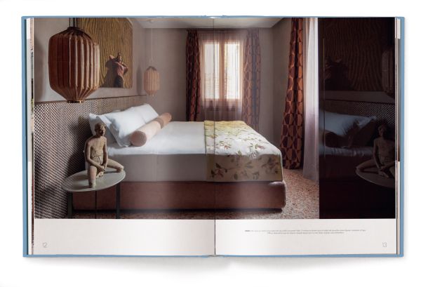 Book cover of Living Heritage: Modern Interiors in Old-Town Homes; with an interior living room with curved sofas and fireplace. Published by teNeues Books.