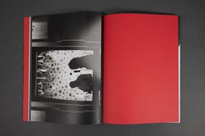 Book cover of Walking Distance, with red filter over seascape, vertical red line to centre. Published by Verlag Kettler.