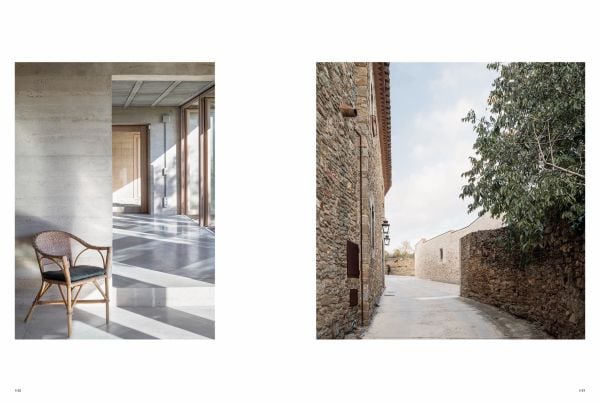 Magazine cover of a+u 21:07, 610: Feature: House Looking into the World, with an interior living space with spiral staircase, houseplants, and white rugs. Published by Shinkenchiku-Sha Co., Ltd.