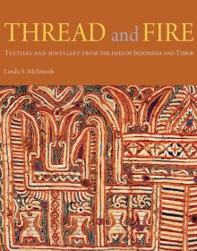 Decorative ancient textile in orange and cream, on cover of 'Thread and Fire, Textiles and Jewellery from the Isles of Indonesia and Timor', by River Books.