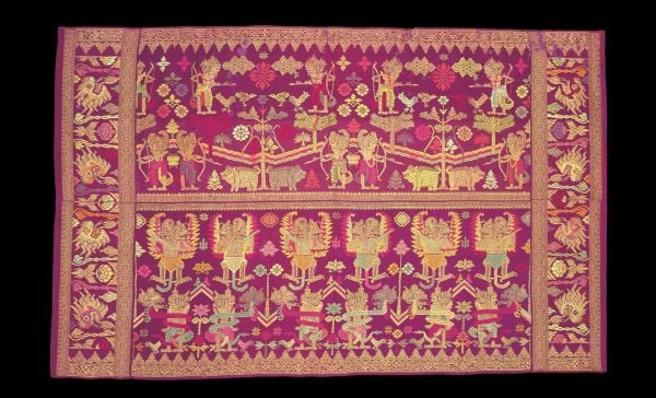 Decorative ancient textile in orange and cream, on cover of 'Thread and Fire, Textiles and Jewellery from the Isles of Indonesia and Timor', by River Books.