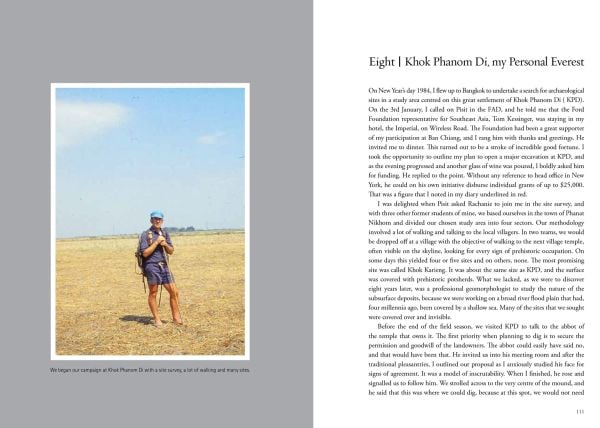 Book cover of Digging Deep: A Journey into Southeast Asia's past, with the British archaeologist in blue shirt and denim shorts, standing in excavated ground, high wall behind. Published by River Books.