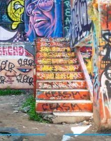 Graffiti style head with helmet, dripping pain, BANGKOK STREET ART AND GRAFFITI in black font down right edge.