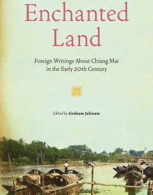 Book cover of Enchanted Land, with Nawarat Bridge over the Ping River, and long-tail boats, in Chiang Mai. Published by River Books.