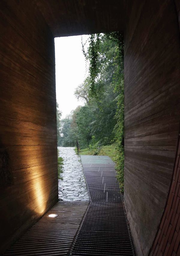 Yellow book cover of A Passage Through Prague Architecture, with cathedral building. Published by Tongji University Press.