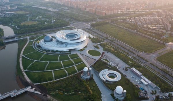 Book cover of Ennead Architects, Architecture of the Cosmos: Shanghai Astronomy Museum, with an aerial plan of interior of building. Published by Tongji University Press.