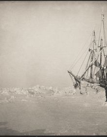 Shutter shape of shots from arctic expedition, on black cover, THE NANSEN PHOTOGRAPHS, in white font below.